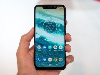 A Motorola One Power Smartphone held up against a background at IFA 2018