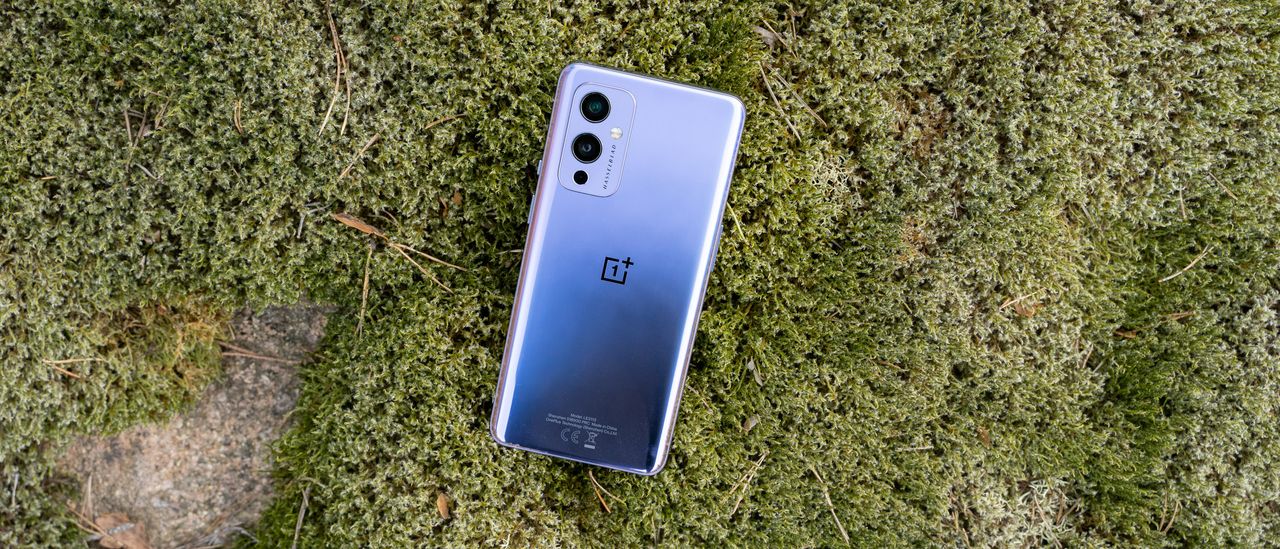 A OnePlus 9 from the back, lying on the ground