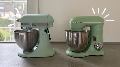 The Salter British Bakes Green Stand Mixer next to the KitchenAid 4.7L Stand Mixer in Spearmint on the counter