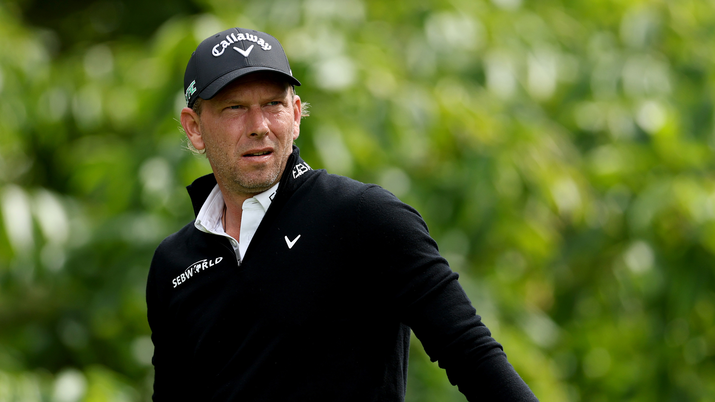 Marcel Siem wearing a black Callaway cap and black sweater
