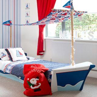 children room with sail boat bed
