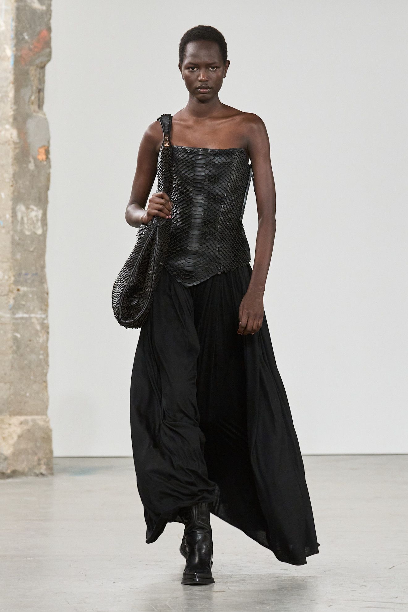 An image of a woven leather bag.