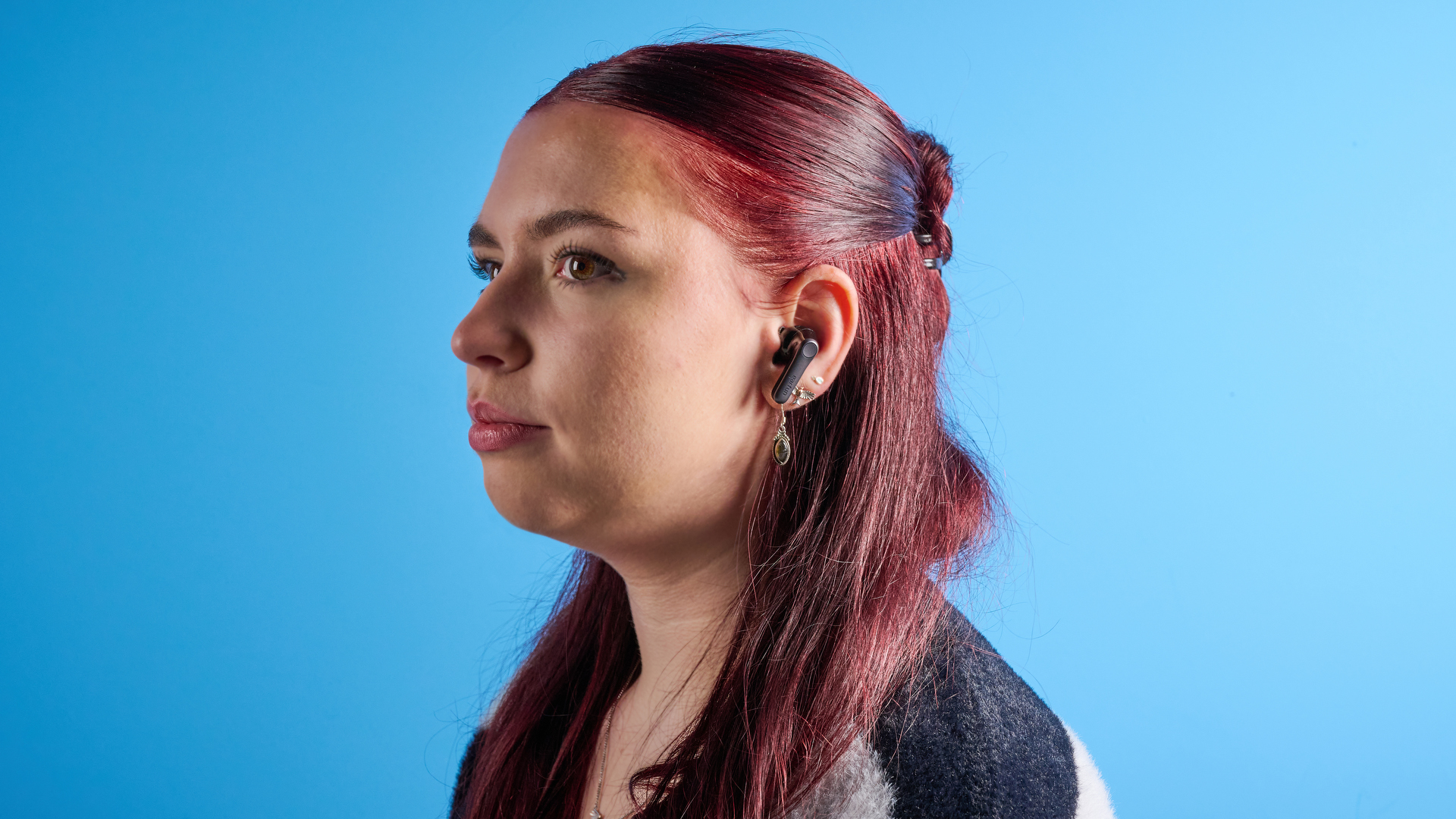 the earfun air pro 4+ earbuds in black showing the ear tips, charging case, and being worn