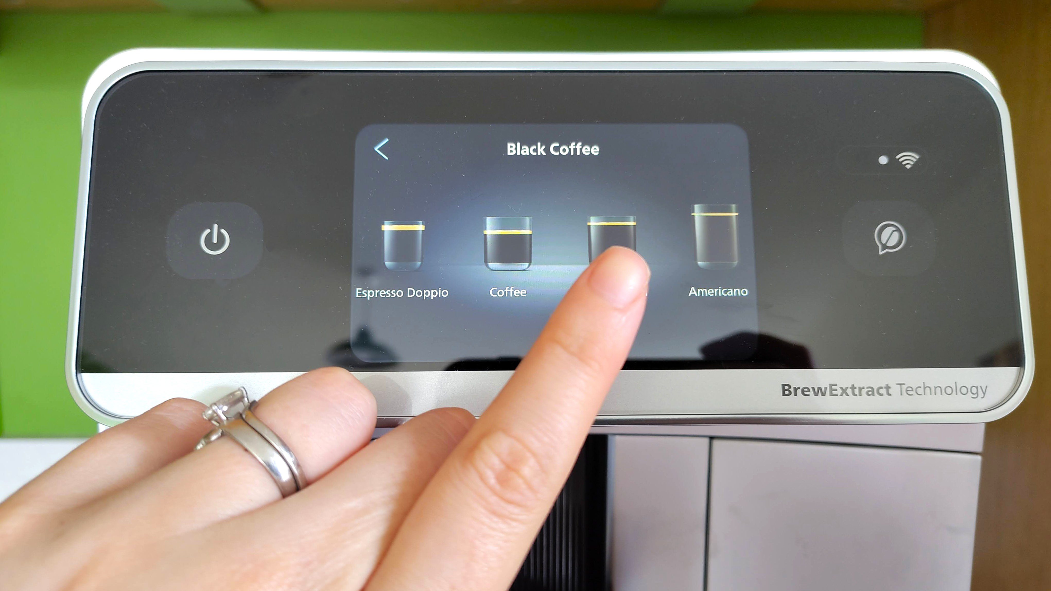 Selecting a black coffee from Philips Cafe Aromis Series 8000 coffee maker's menu