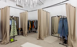 A supersized changing room set complete with rails and canvas drapes