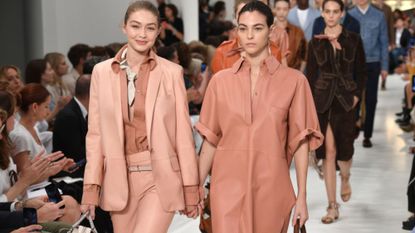 Gigi Hadid and Vittoria Ceretti walk the Tods runway together. 