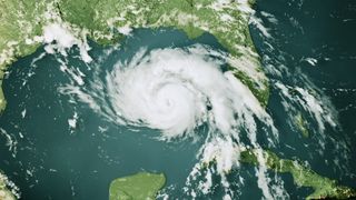 A map showing a hurricane storm cloud over the Gulf of Mexico