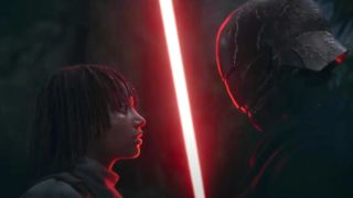 A young Jedi woman is looking up at a menacing dark figure looming above her. The dark figure holds a bright red lightsaber between them.