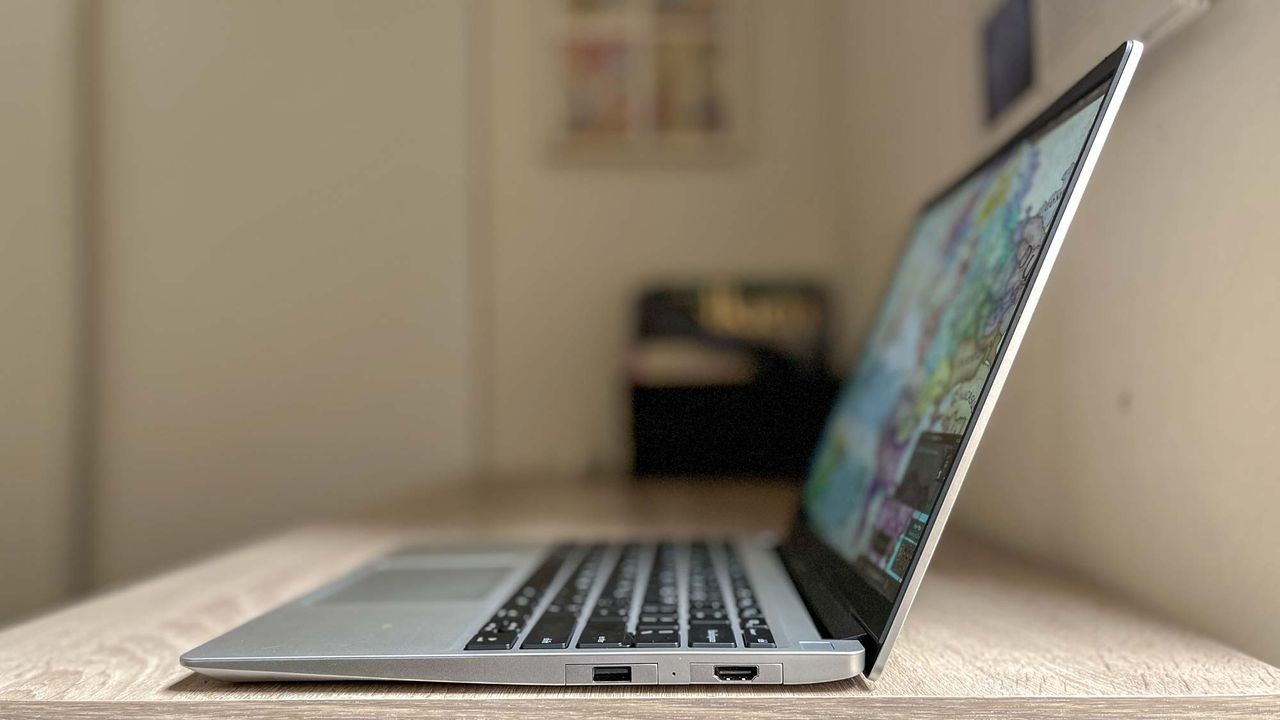 Framework Laptop 13 (2023) review unit on desk, righthand port array facing camera