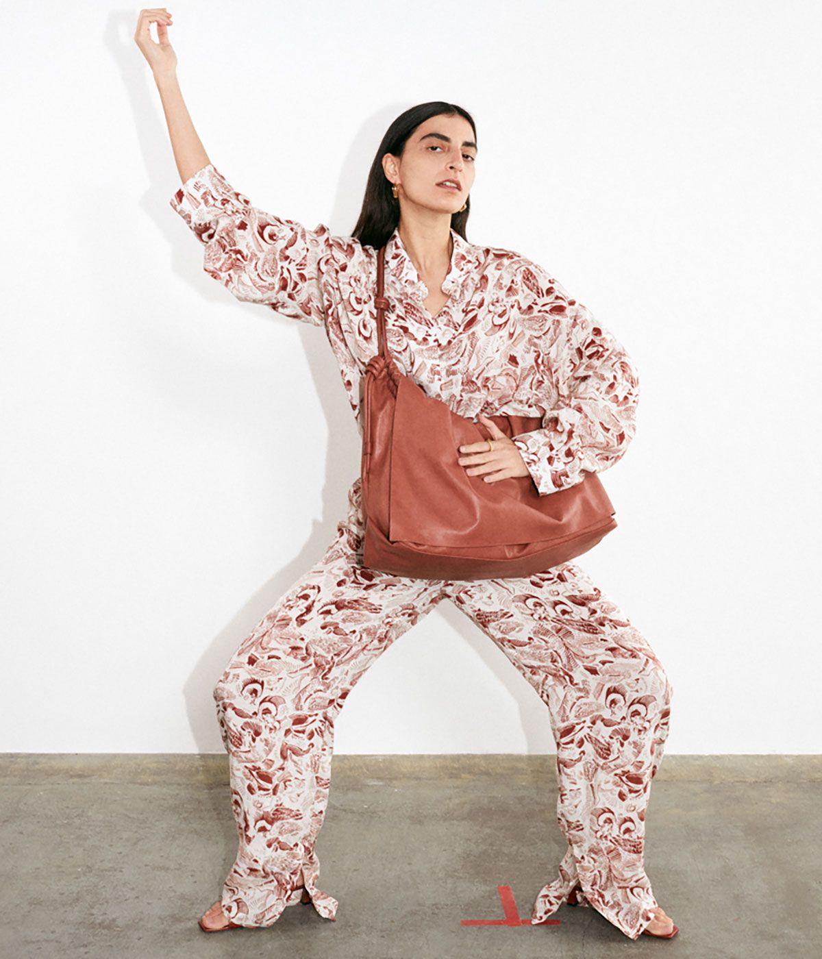 Model wears Aeron Pre-Fall 2021 patterned shirt and trousers