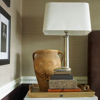 bedroom with lamp on table and tray