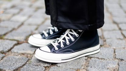 Influencer Maria Barteczko wearing black sneakers by Converse during a street style shooting on July 15, 2022 in Berlin, Germany