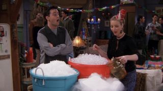 Phoebe showing Chandler her big buckets of ice in Friends