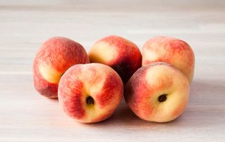 Five fresh ripe peaches