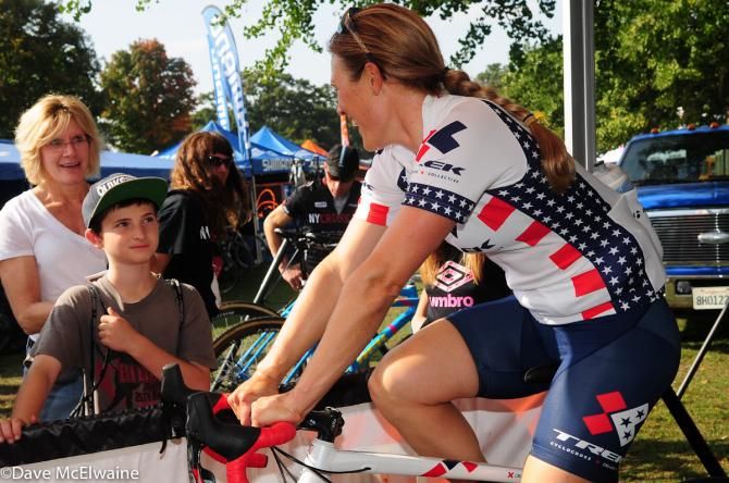 Katie Compton (Trek Cyclocross Collective) answers questions from kids while warming up