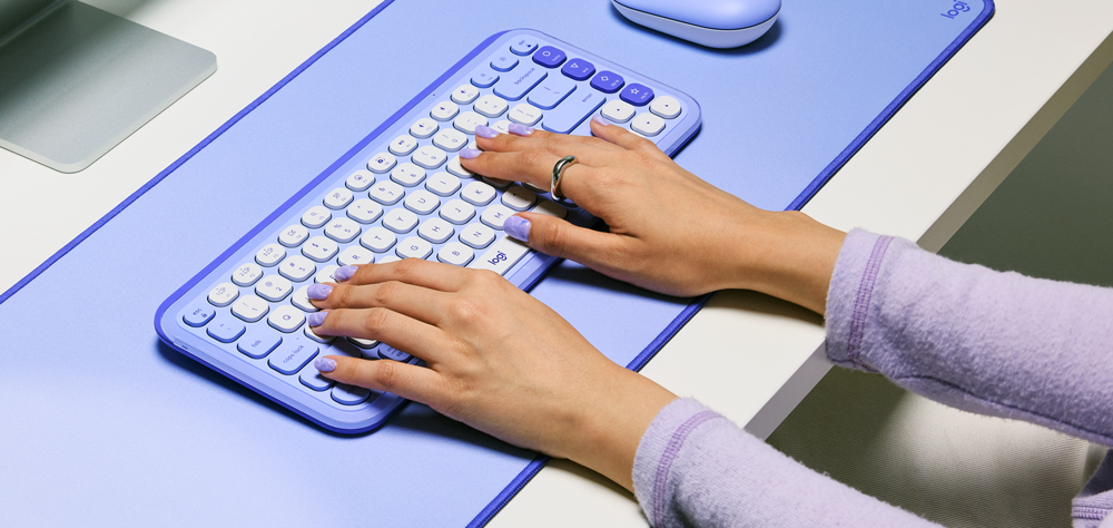 Woman&#039;s hands on Logitech POP Icon Keys keyboard