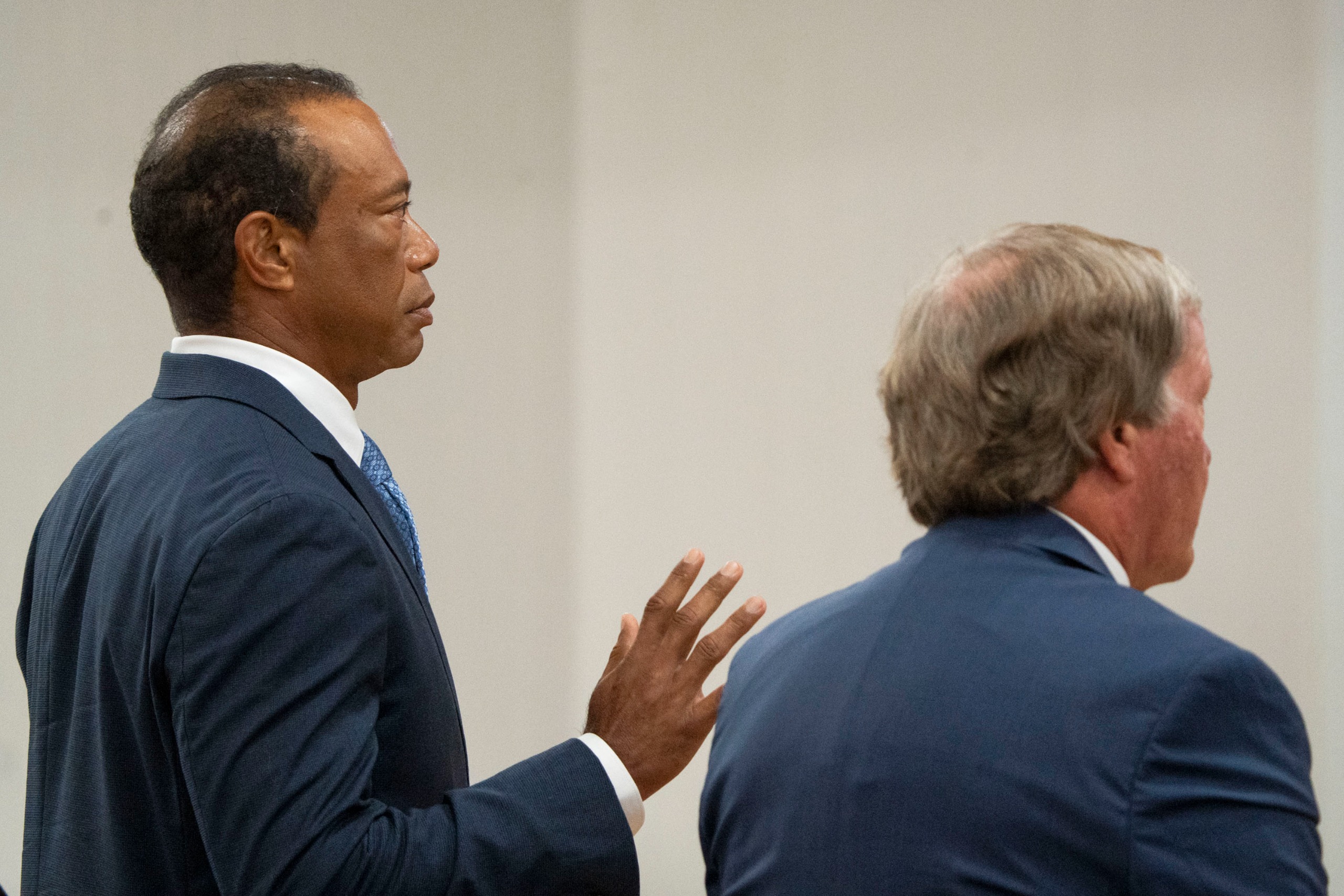 Tiger Woods raises his hand during a court hearing on Wednesday, September 2, 2026