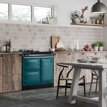 kitchen with wooden flooring and wooden cabinet with wooden dining set and aga eR3 90cm range cooker