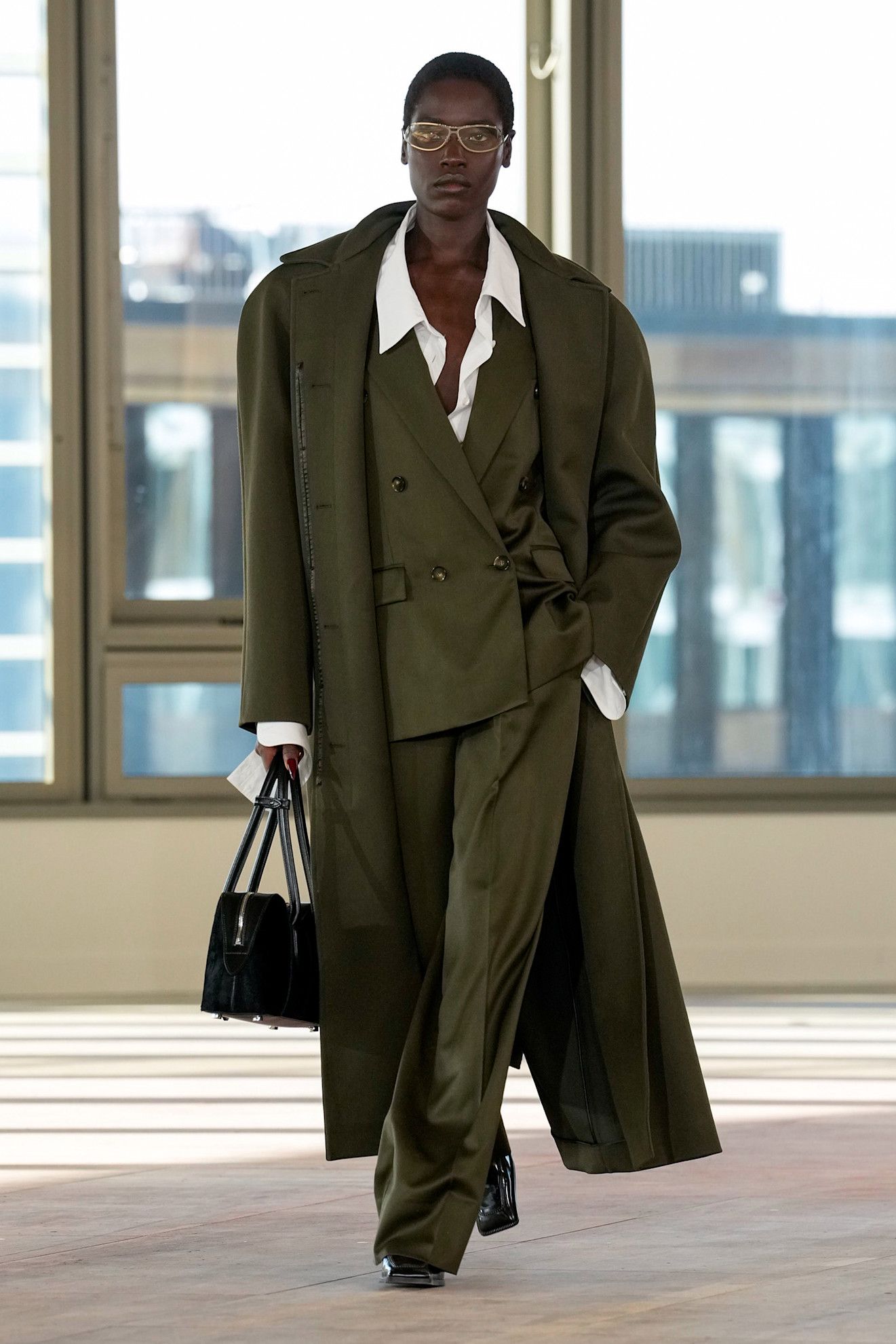 Model wears khaki on the Stella McCartney Runway