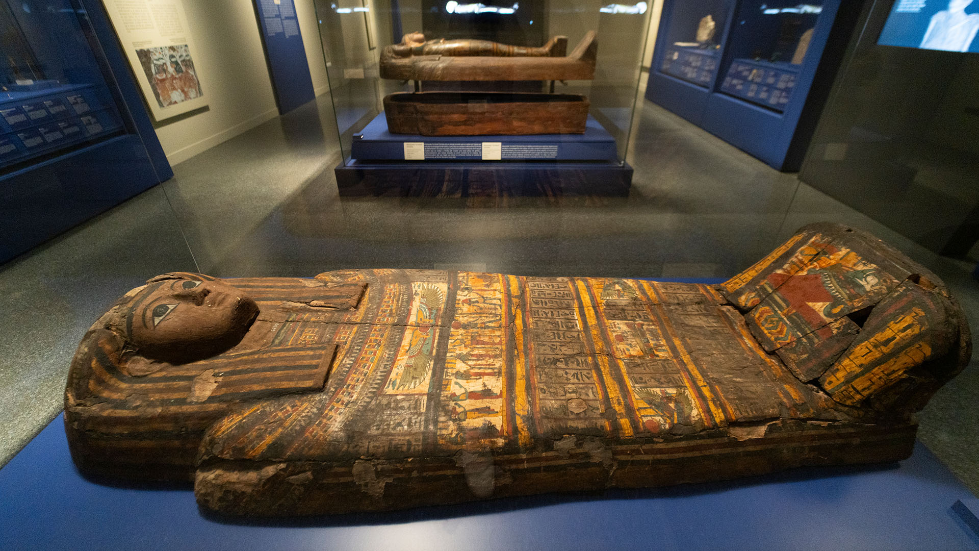 Sarcophagi on display during the exhibition 'Mummies of Egypt: Rediscovering Six Lives'.