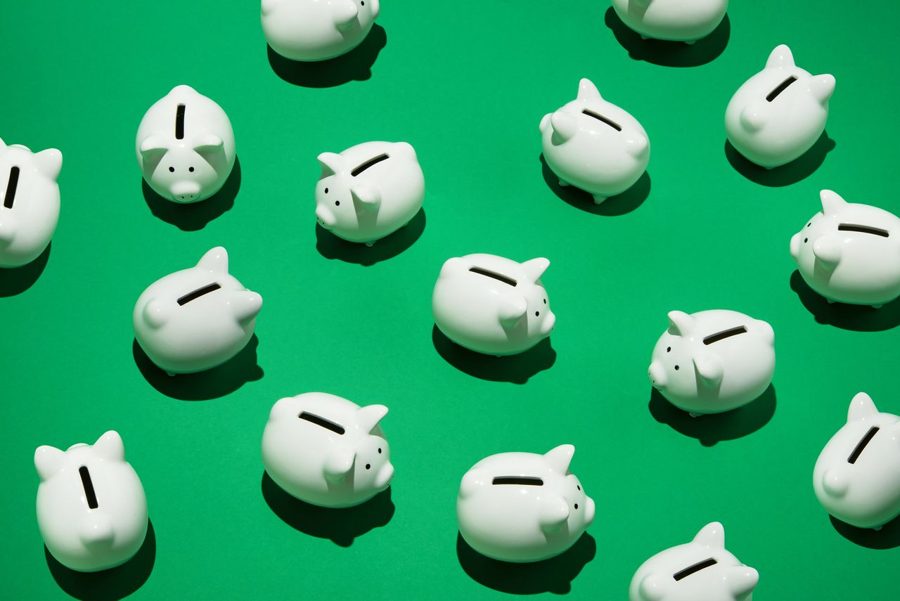 piggy banks on green background