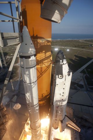 Space shuttle Discovery ignites for liftoff on Launch Pad 39A at NASA's Kennedy Space Center in Florida beginning its final flight to the International Space Station on the STS-133 mission.