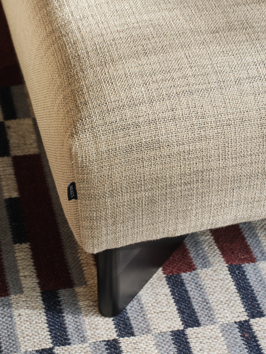 Close-up details of the Nathan Yong-designed sofa, from its softly curved upholstery and tailored seams to the refined proportions that give it an elevated contemporary feel.