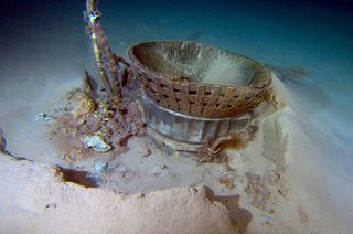 Apollo Saturn V F-1 engine thrust chamber on the ocean floor, as seen where it sat for more than 40 years before being recovered in 2013.