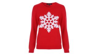 best Christmas jumpers as illustrated by a red jumper with a white glittery snowflake on the front