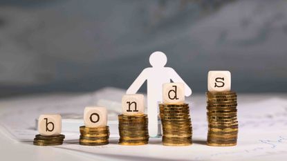 bonds spelled out with blocks on stacks of coins