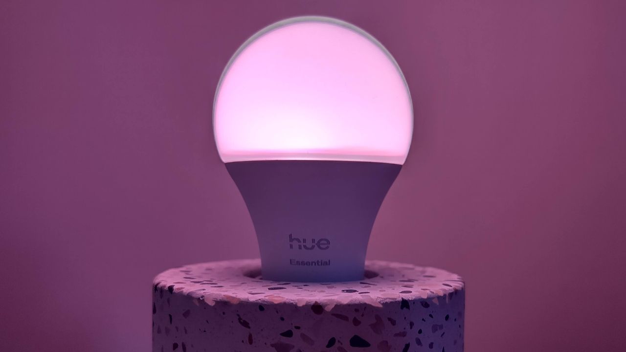 Philips Hue Essential bulb set to purple showing dark 'halo' around the top