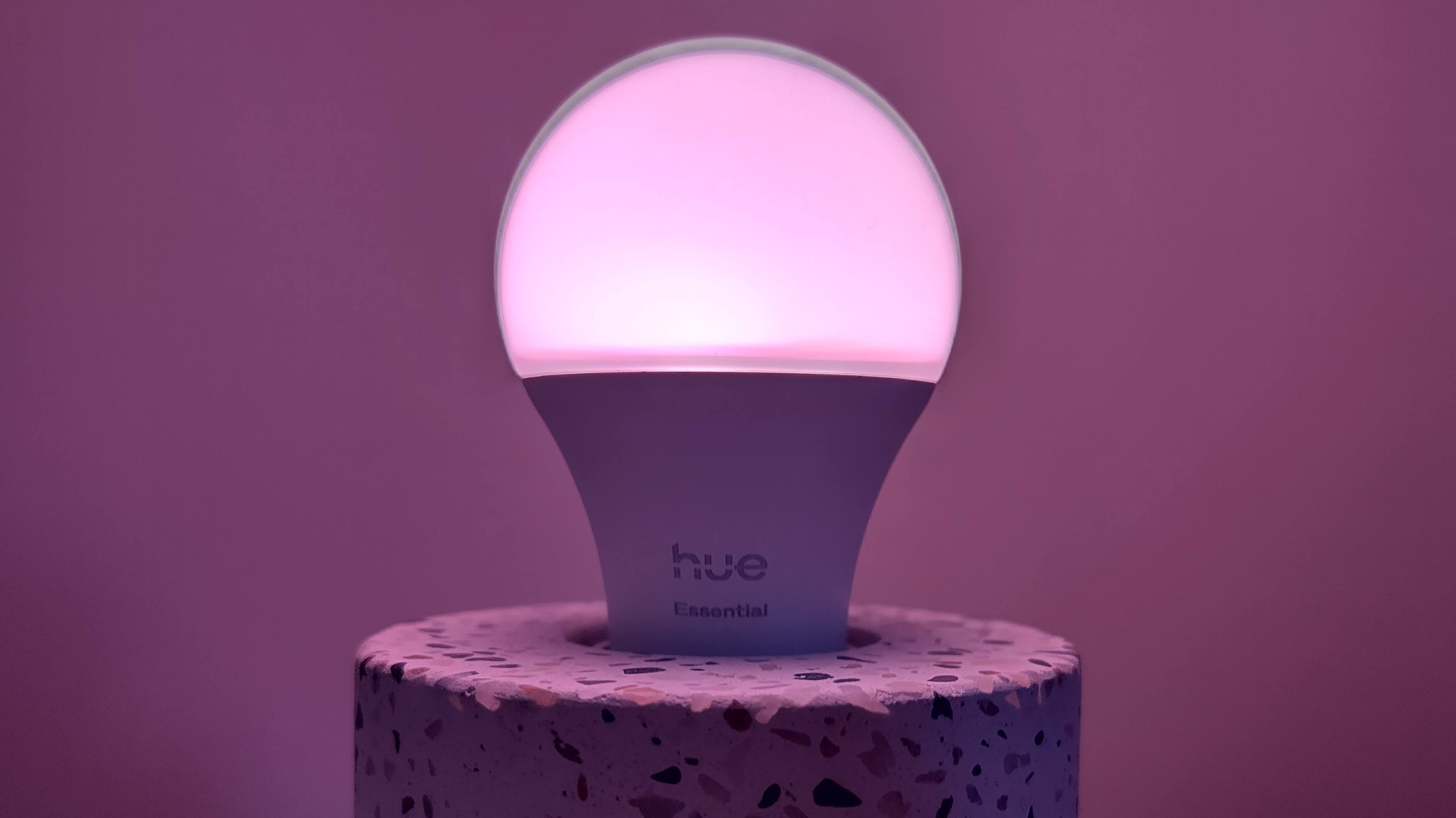 Philips Hue Essential bulb set to purple showing dark "halo" around the top
