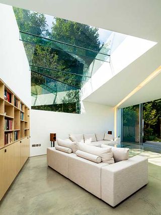 structural glazing floods this living room with natural light