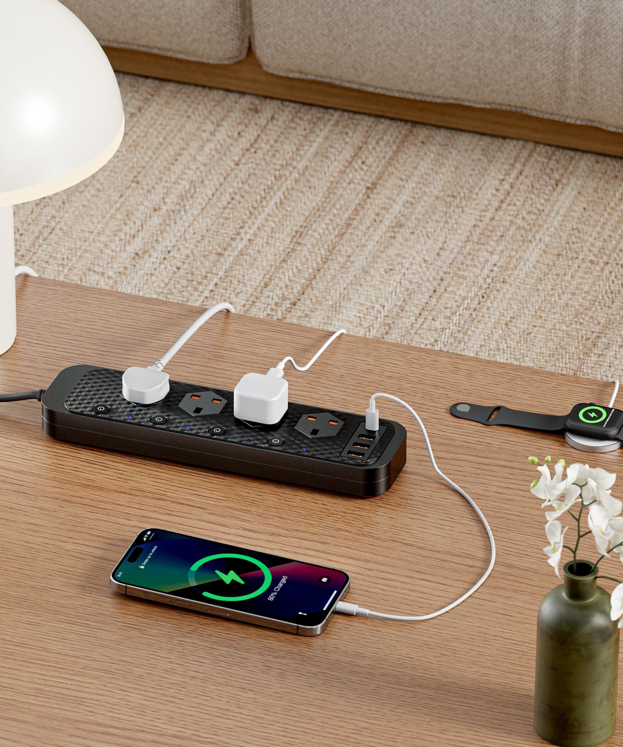 table with extension socket on top with plugs charging phone and smartwatch