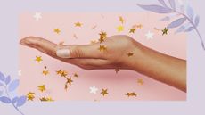 A woman's hands with pixie dust nails on a pink backdrop