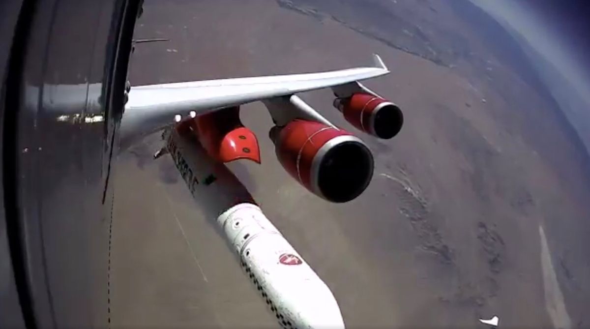 Virgin Orbit’s LauncherOne rocket falls away from its carrier plane during the company’s first-ever drop test on July 10, 2019.