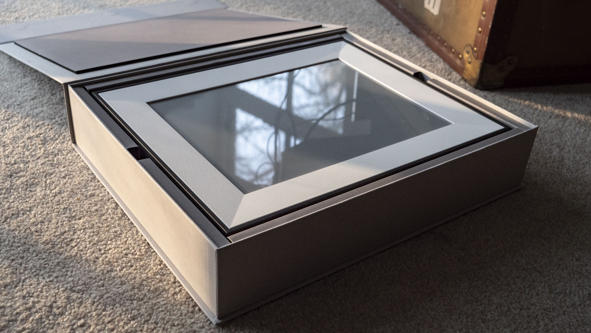 The Aura Ink 'E Ink' digital photo frame's presentation box, opened with the frame inside
