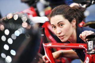Emma Trott holding a red bike