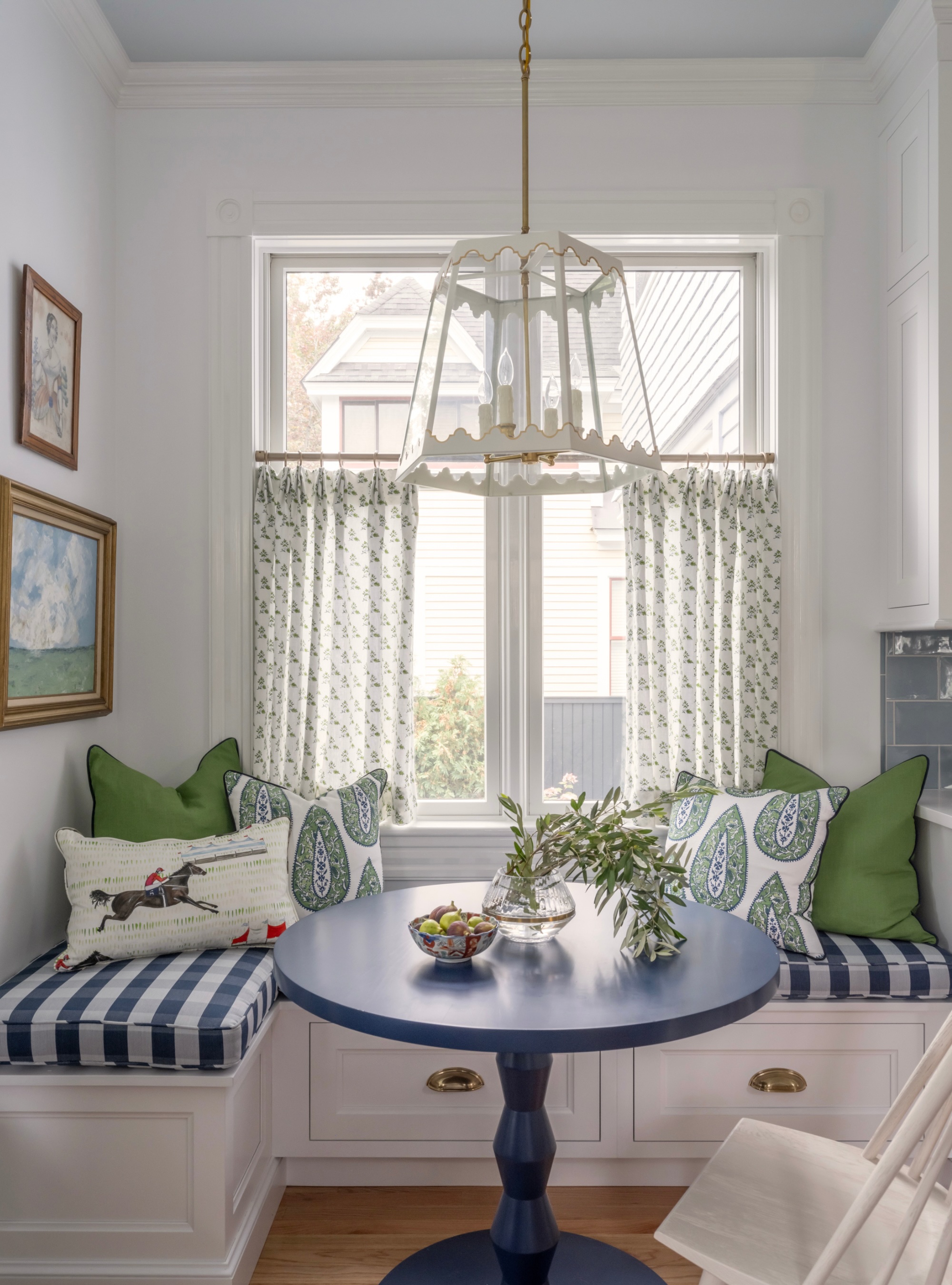 Banquette seating with striped cushions and storage underneath