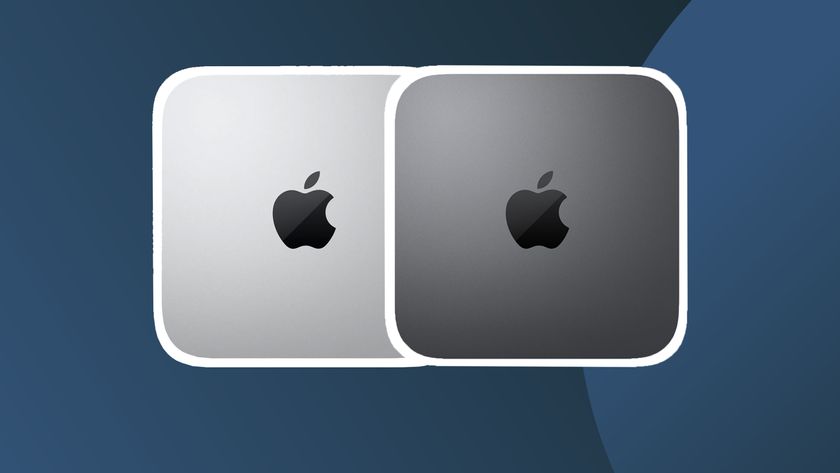 A product shot of two Mac minis on a dark background with a white border