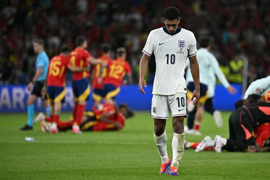 Jude Bellingham reacts as Spain&#039;s players celebrate after winning at the end of the UEFA Euro 2024 final football match between Spain and England at the Olympiastadion in Berlin on July 14, 2024