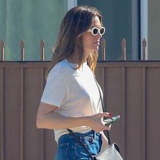 Mandy Moore wearing jeans, a white T-shirt, and leopard-print sneakers in L.A.