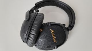 A top-down picture of the Marshall Monitor III A.N.C headphones on a grey background.