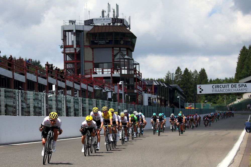 Chris Froome's Team Sky leads the peloton rides towards Raidillon Eau Rouge on Circuit de Spa-Francorchamps during stage three of the 2017 Le Tour de France