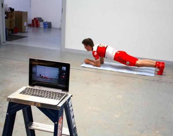 Robbie Hucker executes a basic plank to demonstrate core strength