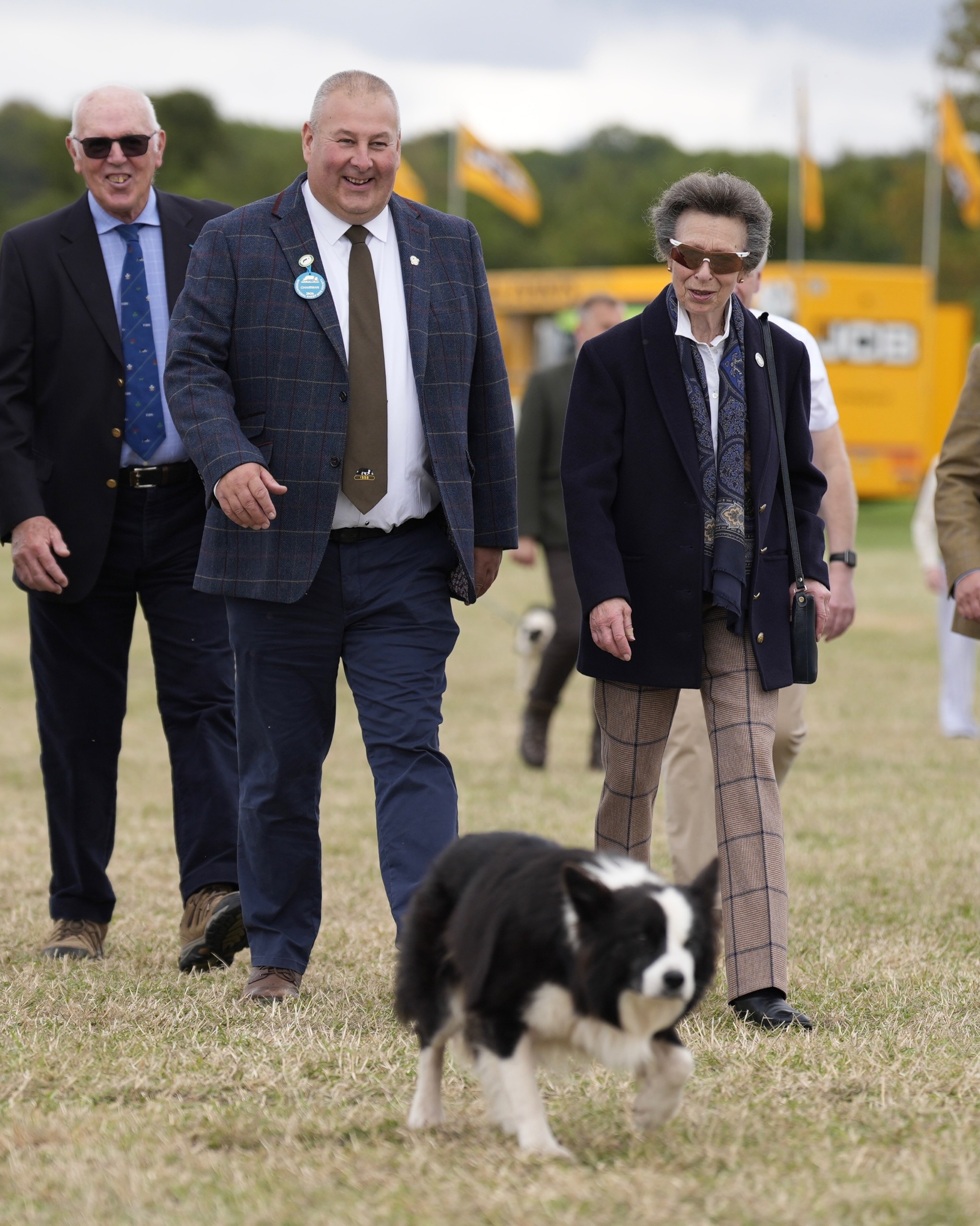 Princess Anne walking with a dog
