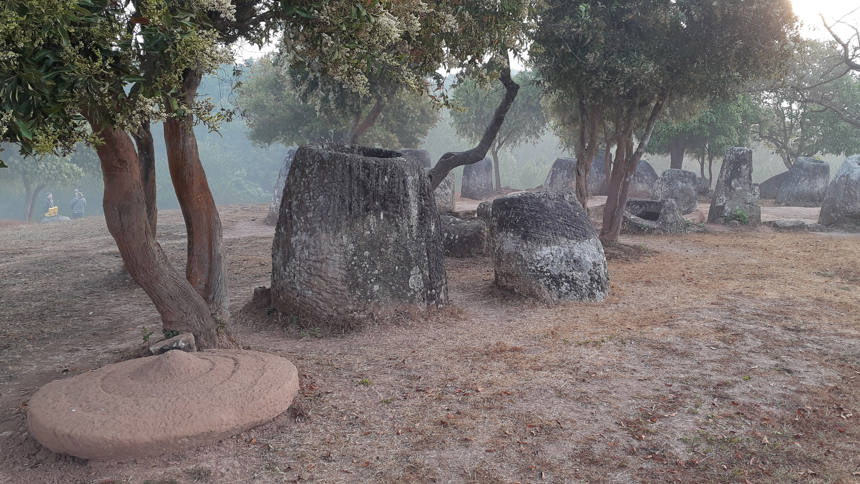 Sunrise at the Plain of Jars in northern Laos. The landscape is dotted with carved stone jars, some of them up to 10 feet (3 m) tall and estimated to be about 3,000 years old.