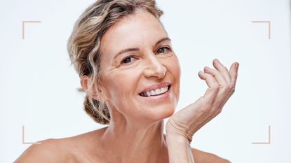 A blonde woman with beautiful skin, after an aquagold facial, on a grey background