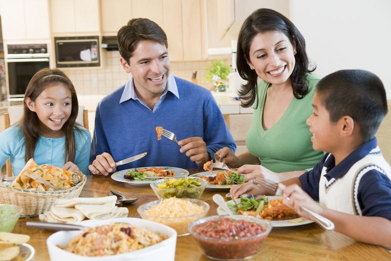 A family eats dinner together