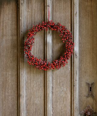 Thanksgiving wreath ideas with a small wreath made from branches with red berries